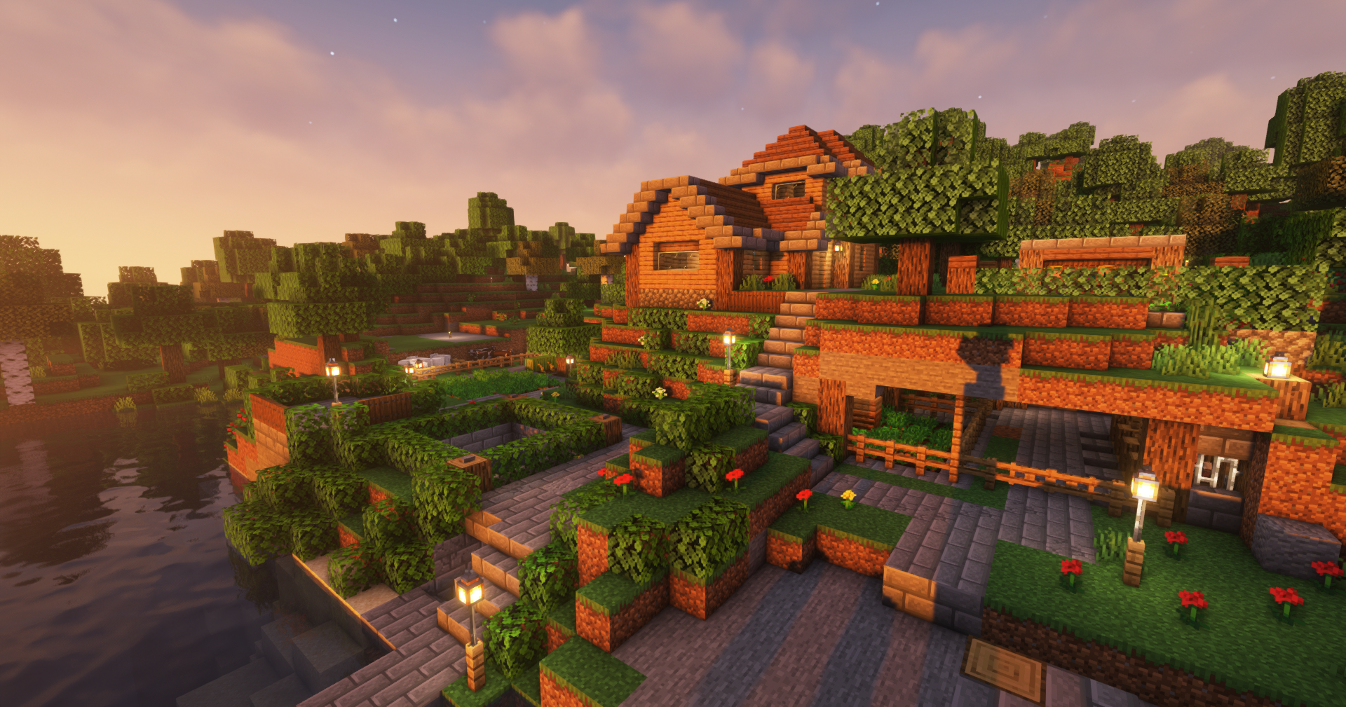 A small waterfront cottage with front landscaping. The building has two stories and an underground garage or stable.